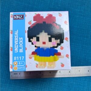 Girls Pixel Block Toy in Black, Blue, Yellow, Red